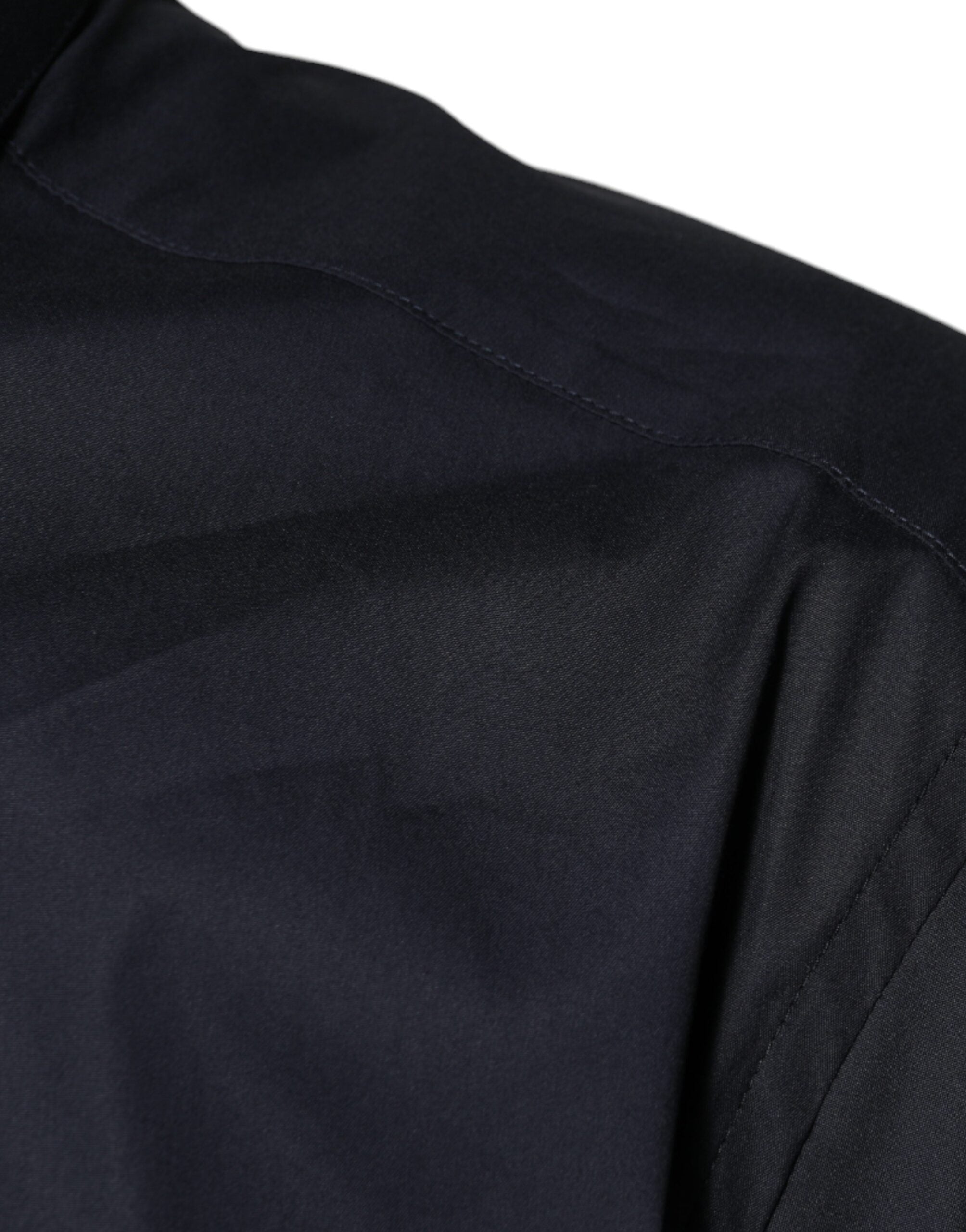 Chemise formelle noire en coton mélangé Dolce & Gabbana avec détails dorés, vue de face.