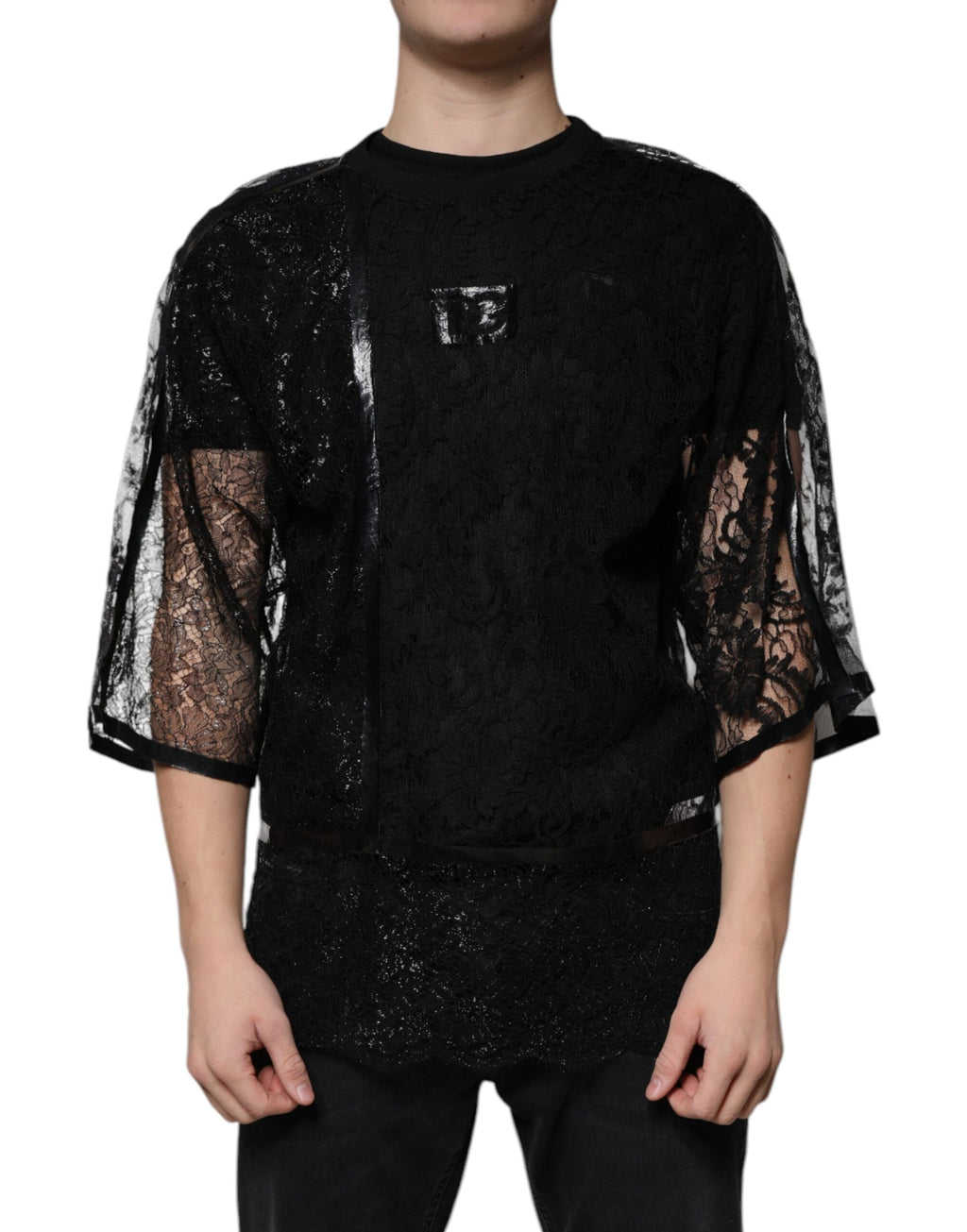 T-shirt noir en nylon avec dentelle florale et col rond de la marque Dolce & Gabbana, vue de face.
