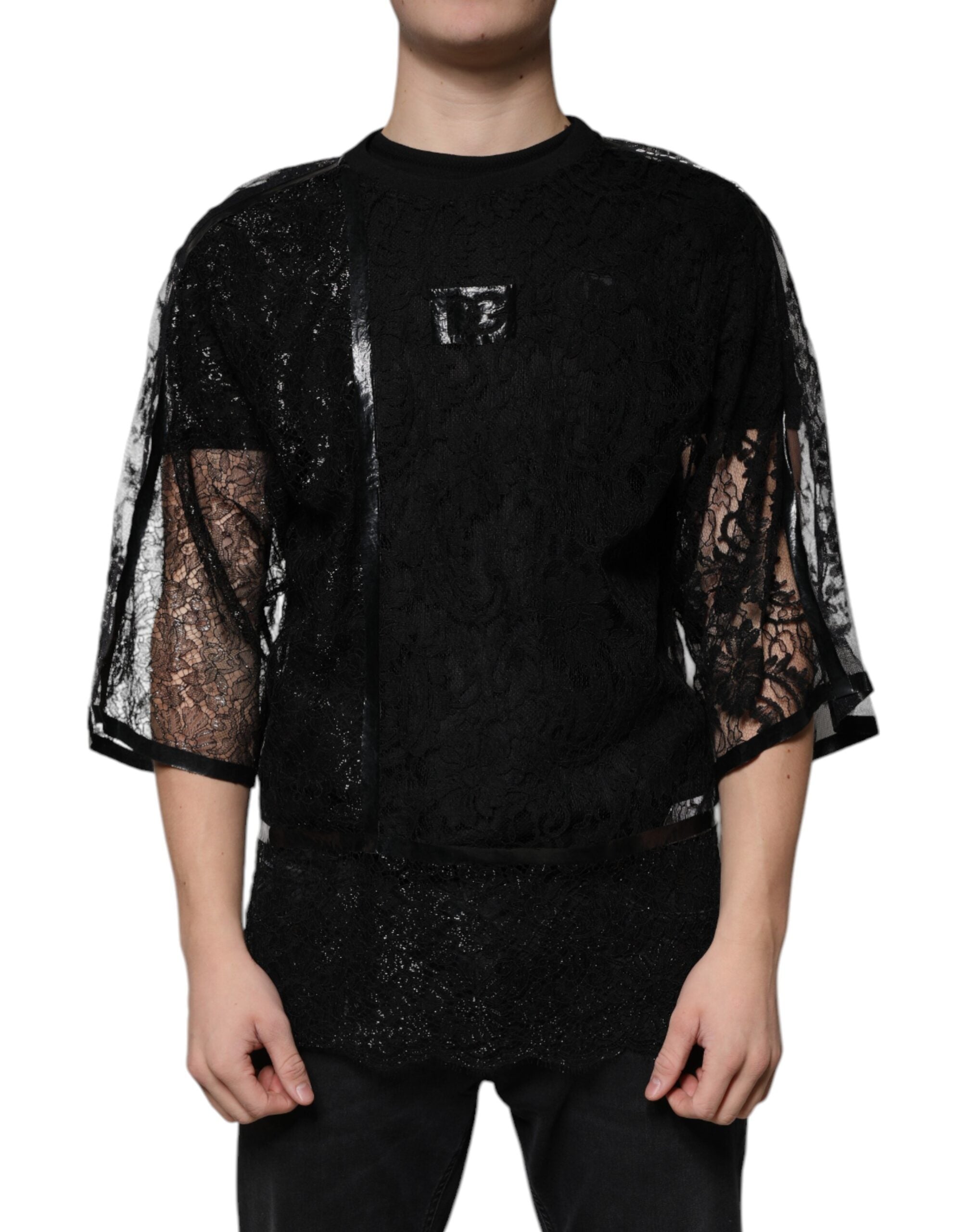 T-shirt noir en nylon avec dentelle florale et col rond de la marque Dolce & Gabbana, vue de face.