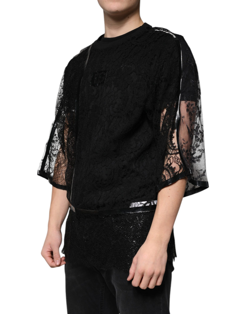 T-shirt noir en nylon avec broderie florale en dentelle et col rond de Dolce & Gabbana, vue de face.