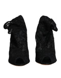 Chaussures Dolce & Gabbana à talons, bottines noires en dentelle extensible, mi-mollet, élégantes et sophistiquées.