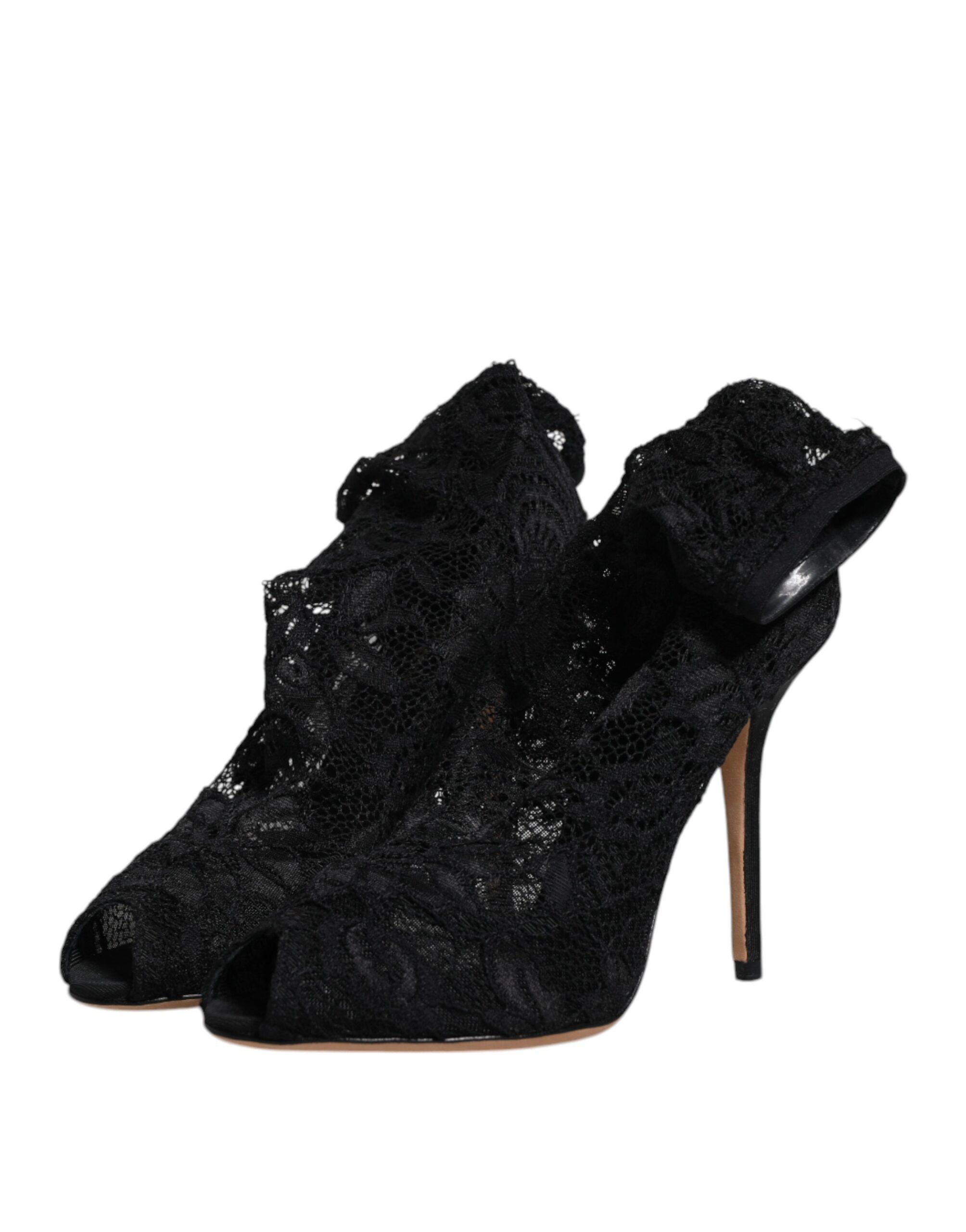 Chaussures Dolce & Gabbana à talons noirs en dentelle extensible, bottines mi-mollet élégantes et sophistiquées.