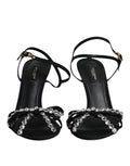 Sandales noires en cuir Dolce & Gabbana avec ruban en cristal et boucle, style élégant et sophistiqué.