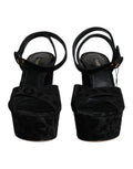 Sandales à talons plateforme Dolce & Gabbana noires à motif léopard, avec design élégant et semelle épaisse.