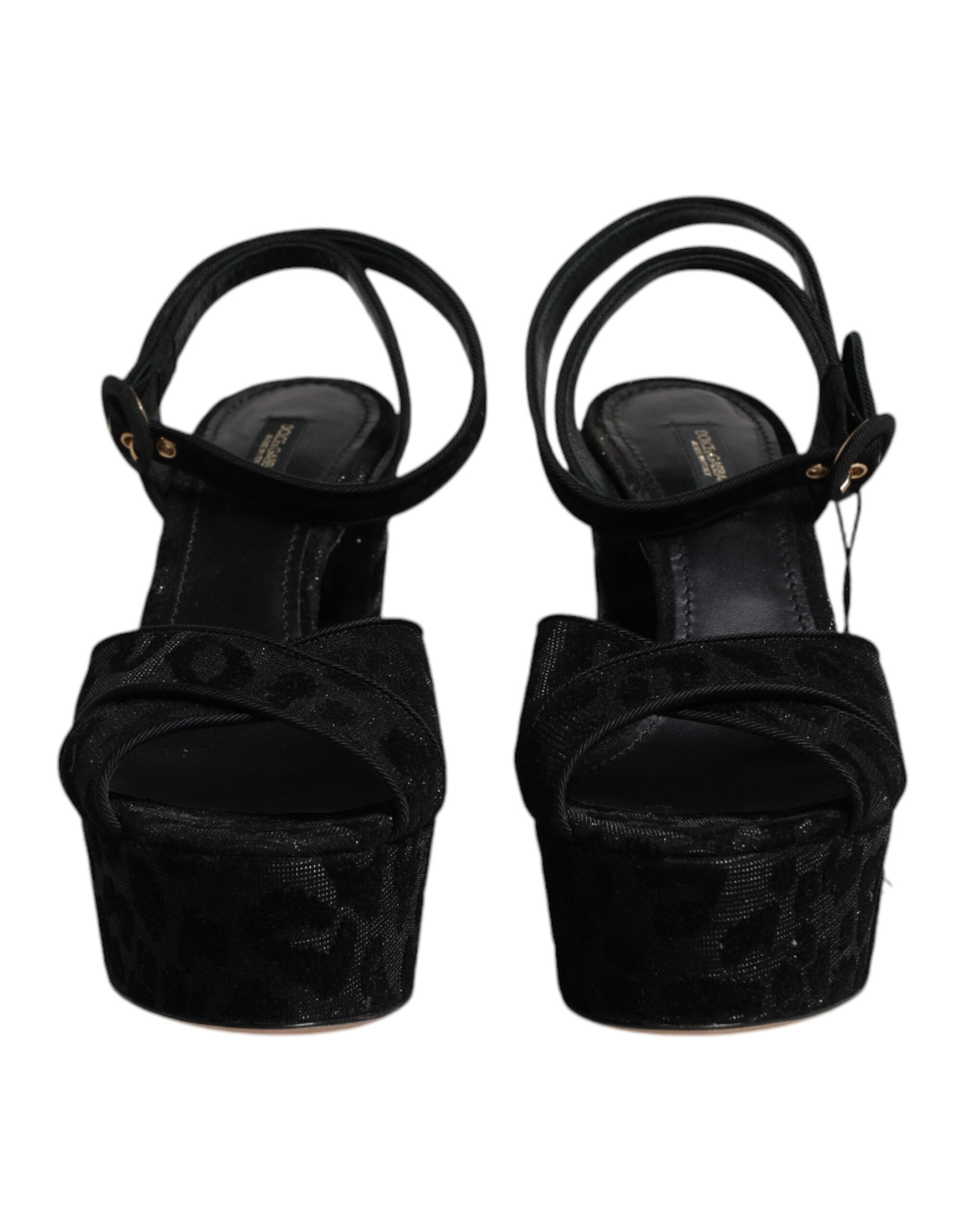 Sandales à talons plateforme Dolce & Gabbana noires à motif léopard, avec design élégant et semelle épaisse.