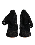 Chaussures Dolce & Gabbana, bottines noires en dentelle stretch et mi-mollet, avec talons élégants.