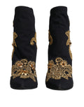 Chaussures à enfiler Dolce & Gabbana noires avec broderie or, boots élégantes en cuir, vue de côté.