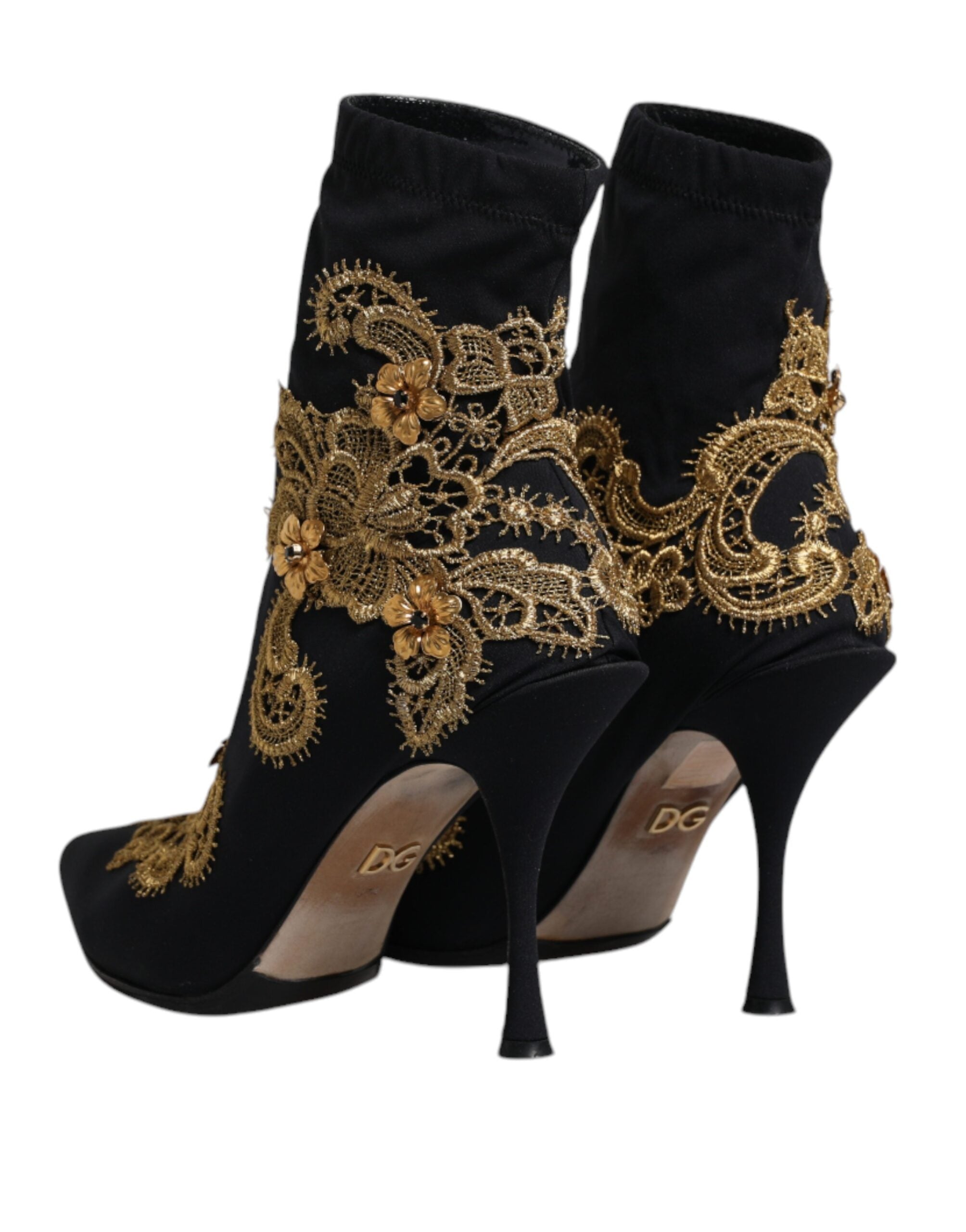 Bottes slip-on Dolce & Gabbana noires avec broderie dorée, design élégant et détails sophistiqués visibles sur l'image.