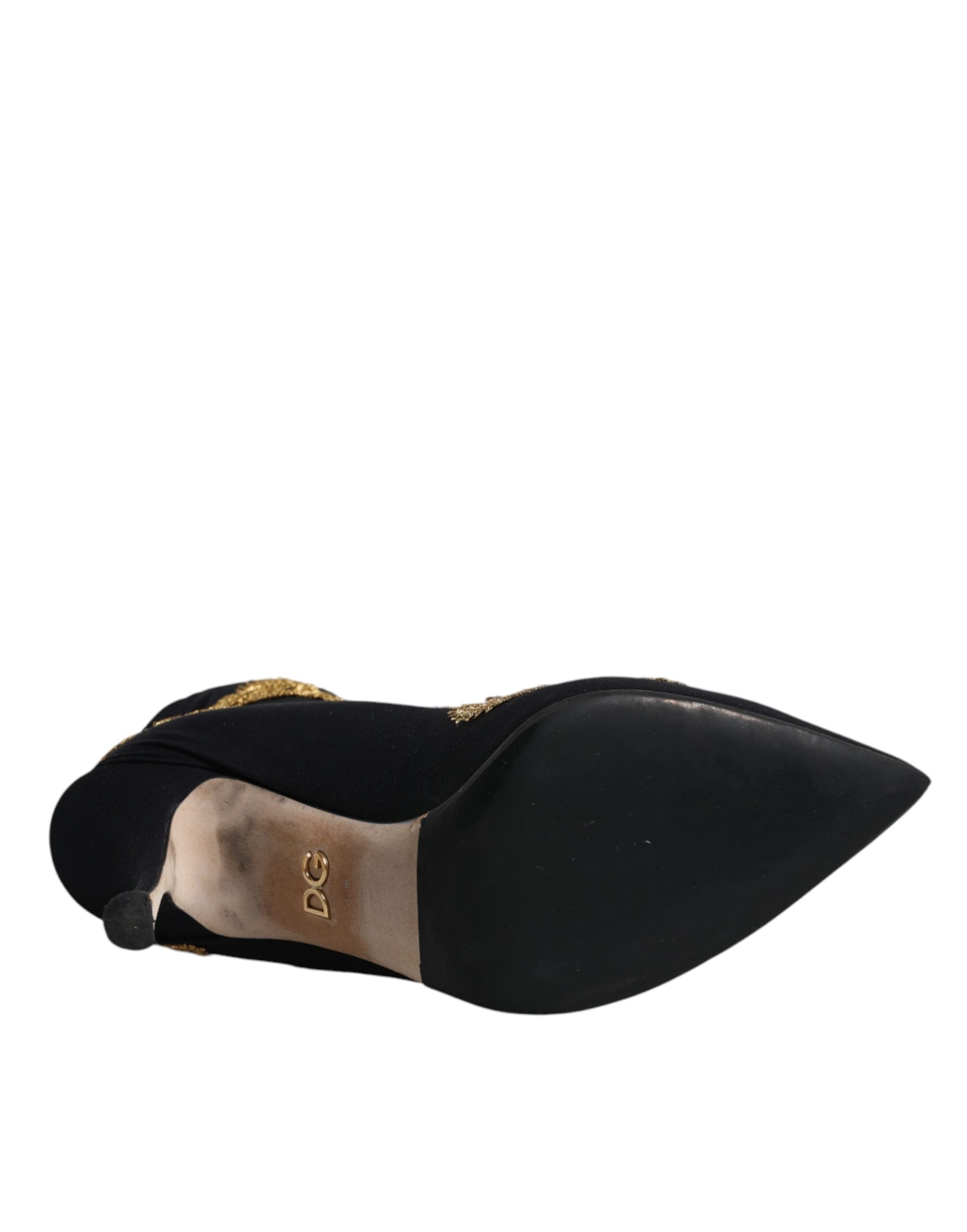 Bottes slip-on Dolce & Gabbana noires avec broderie dorée, style élégant et finition raffinée.