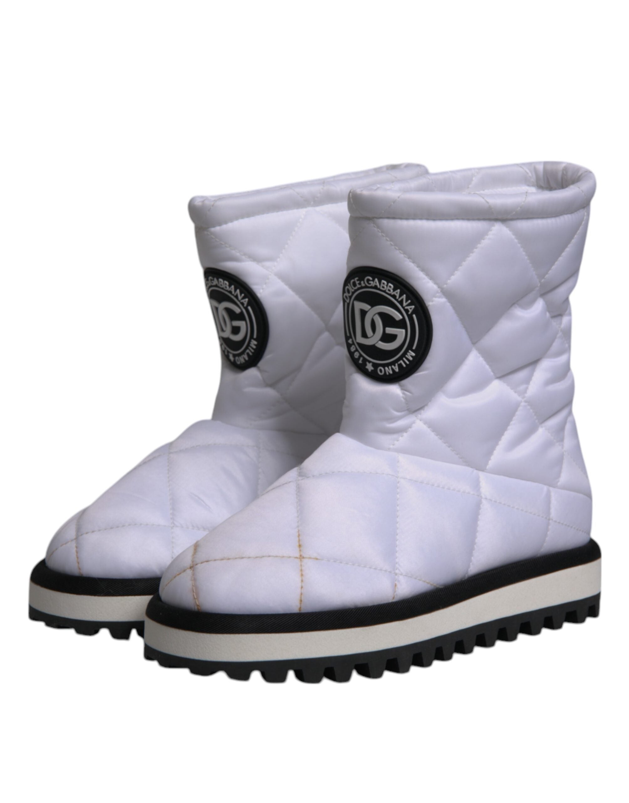 Bottes mi-mollet en viscose blanche de Dolce & Gabbana, chaussures rembourrées avec semelle solide et design élégant.