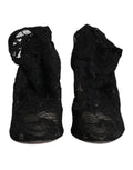 Chaussures Dolce & Gabbana à talons noirs en dentelle extensible, bottines mi-mollet élégantes avec semelle en cuir.