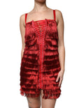 Robe courte sans manches Dolce & Gabbana en dentelle rouge avec des pompons et une coupe ajustée.