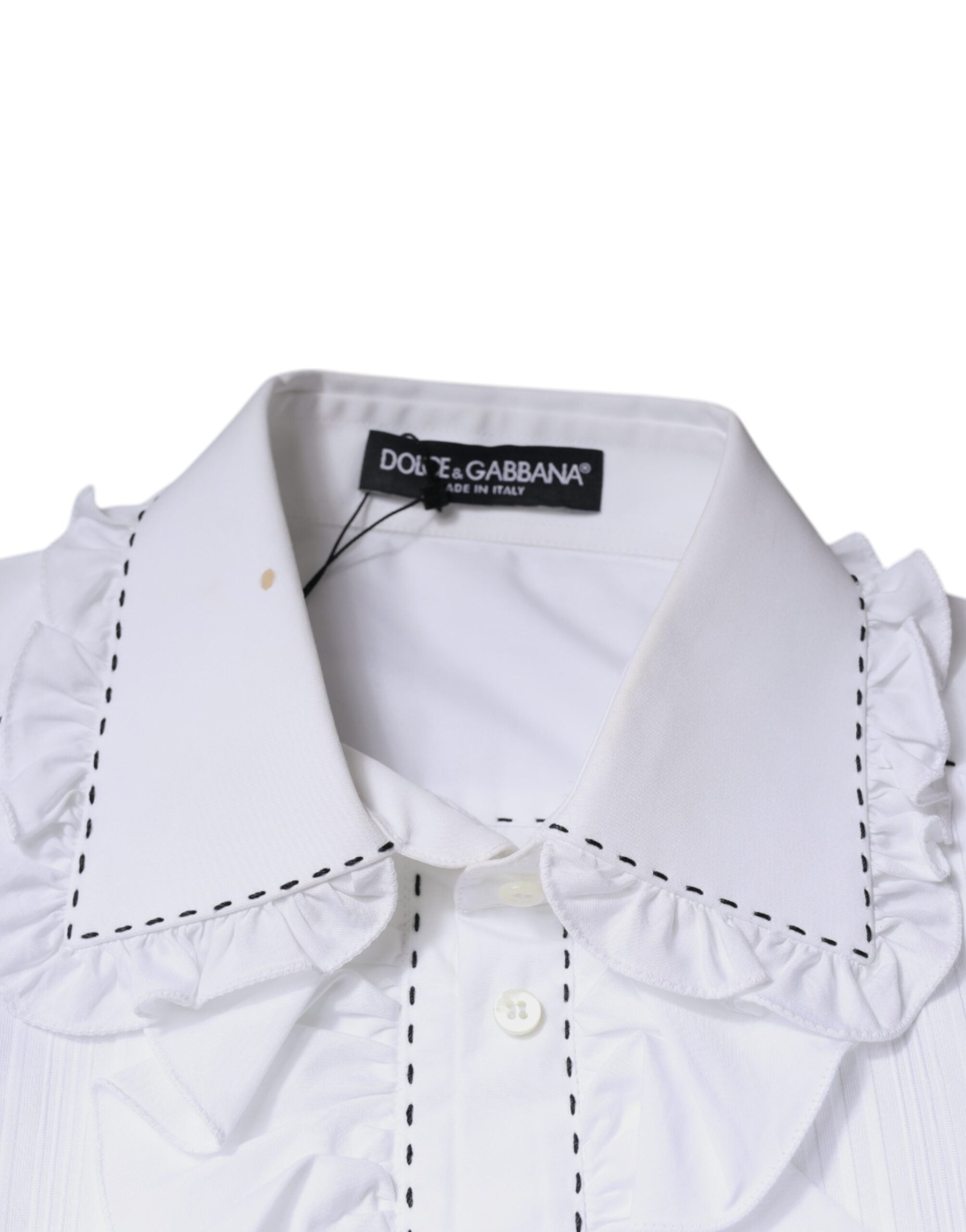 Haut blanc en coton à manches longues Dolce & Gabbana avec col à volants et détails féminins, vue de face.
