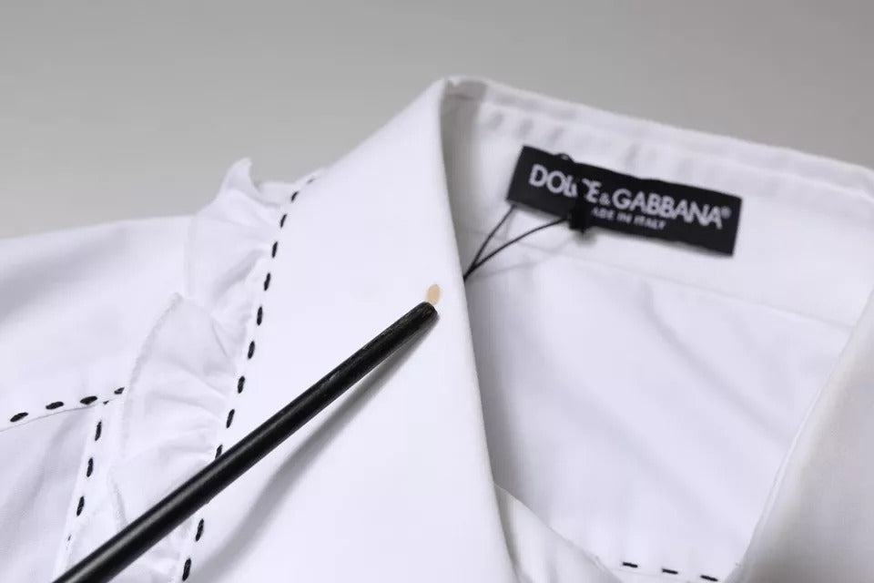 Haut blanc en coton Dolce & Gabbana à manches longues avec col à volants et détails élégants.