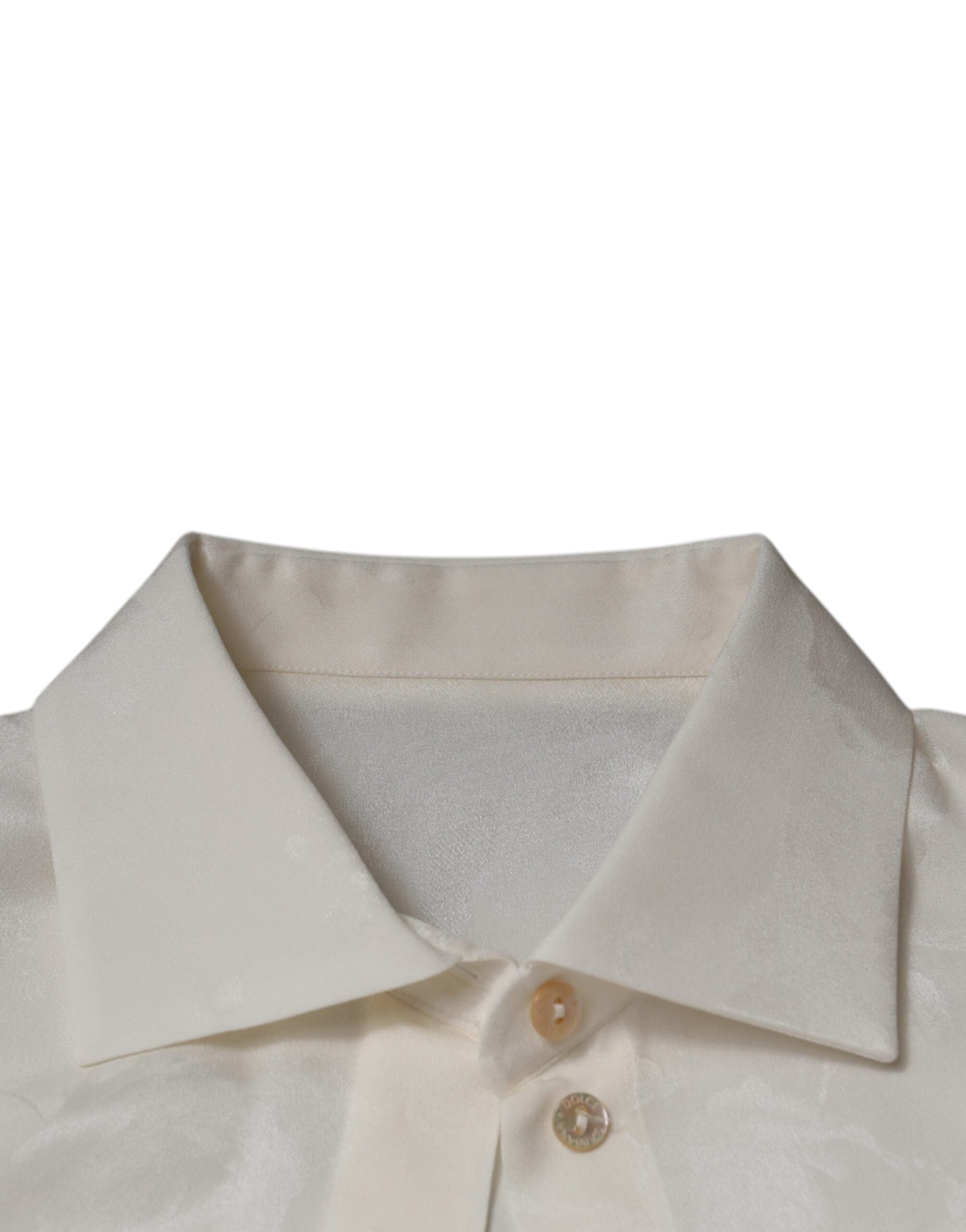 Chemise blanche en soie à col et manches longues de Dolce & Gabbana, élégante et sophistiquée.
