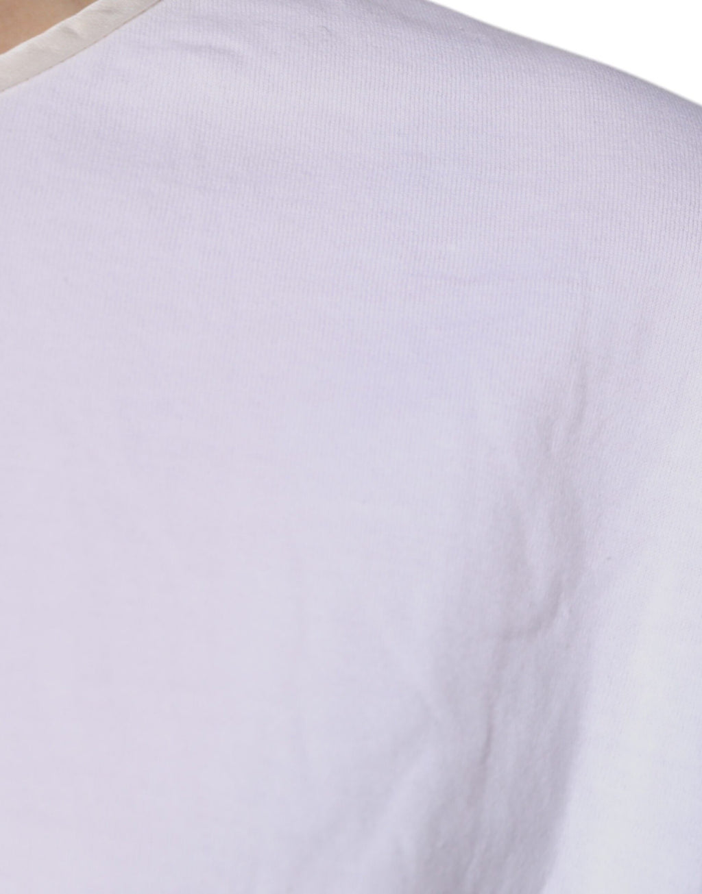 Blouse Dolce & Gabbana en coton et soie blanche à col rond et style wrap, vue de face.