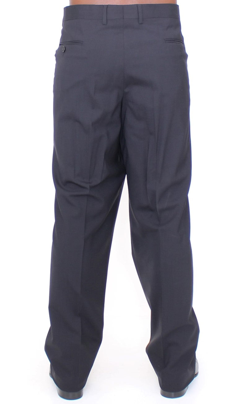 Pantalons plissés en laine noire de Dolce & Gabbana, coupe ajustée et stretch, vue de face.