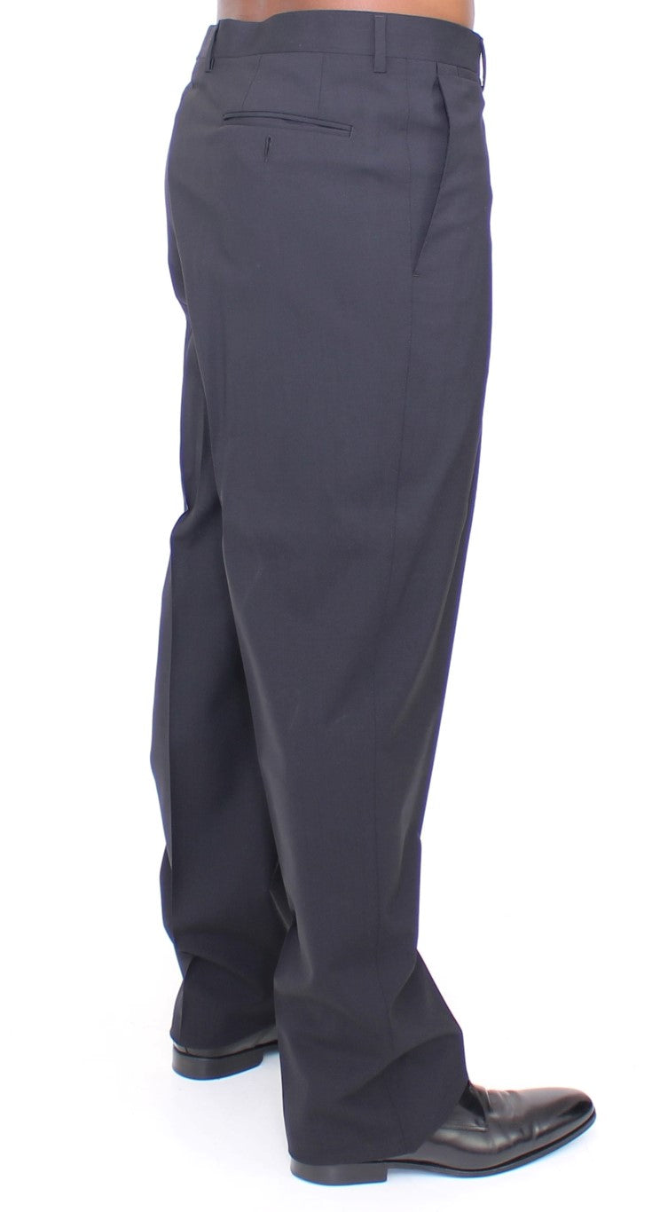 Pantalons plissés en laine noire Dolce & Gabbana, coupe stretch élégante, vue détaillée du tissu et du design.