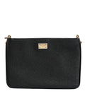 Sac clutch en cuir grainé noir Dolce & Gabbana avec plaque logo élégante, idéal pour une occasion chic.