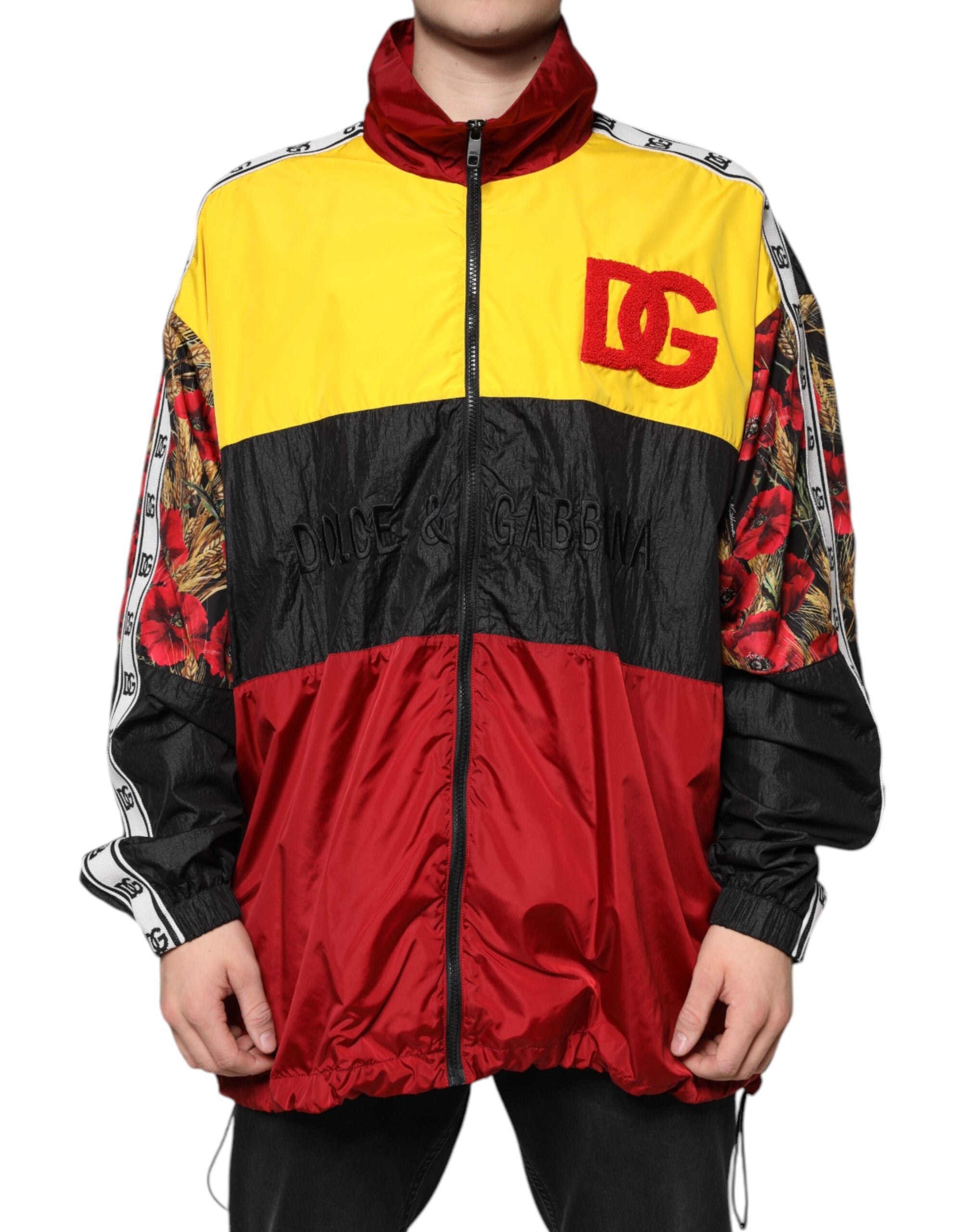 Pull homme Dolce & Gabbana en patchwork multicolore avec fermeture éclair complète, détails colorés et design original.