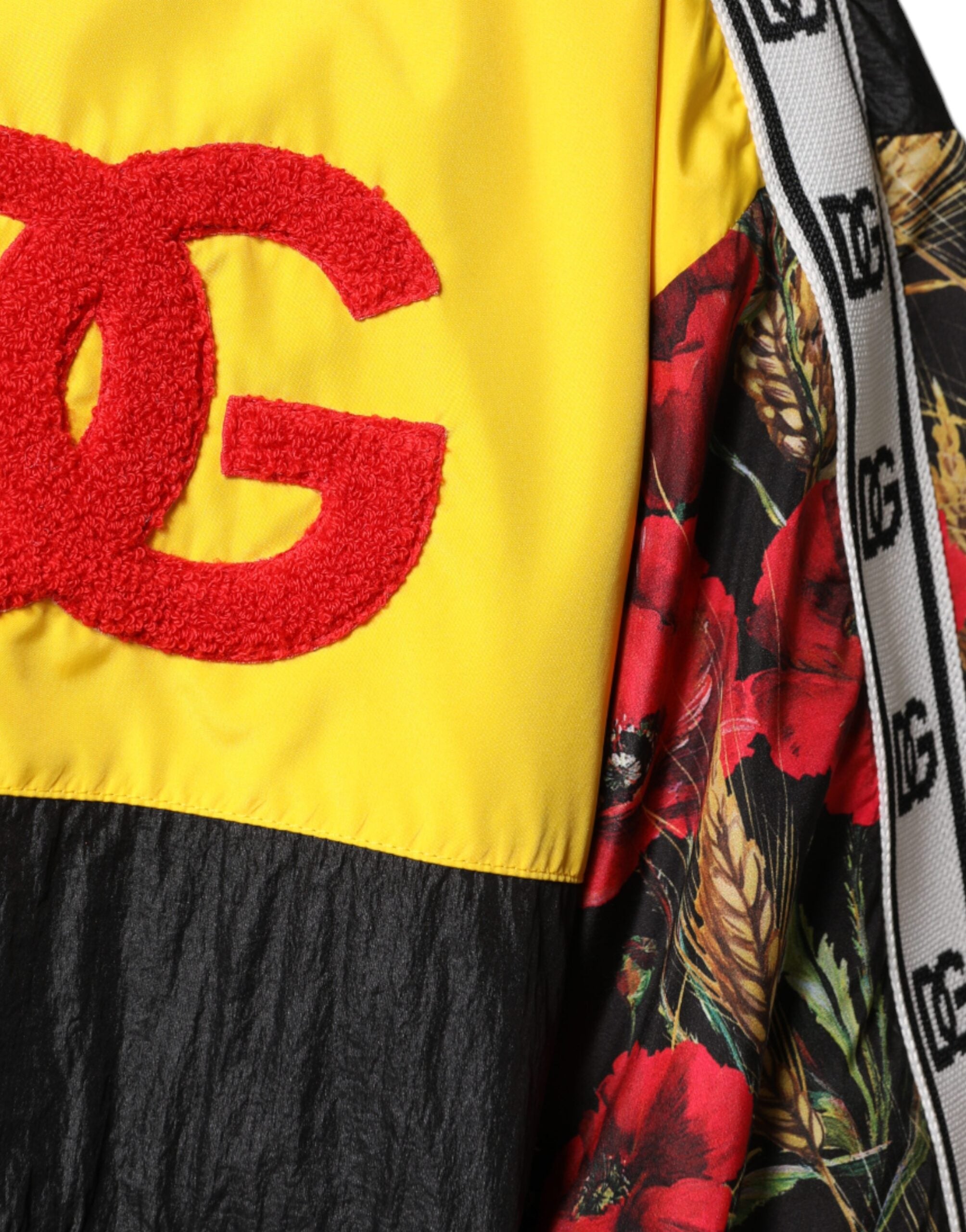 Pull homme Dolce & Gabbana à patchwork multicolore avec fermeture éclair complète, style élégant et décontracté.