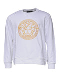 Pull en laine blanc Versace avec broderie Méduse sur le col rond, élégant et tendance.
