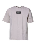 T-shirt beige Dolce & Gabbana à logo DG, col rond et manches courtes, vue de face.