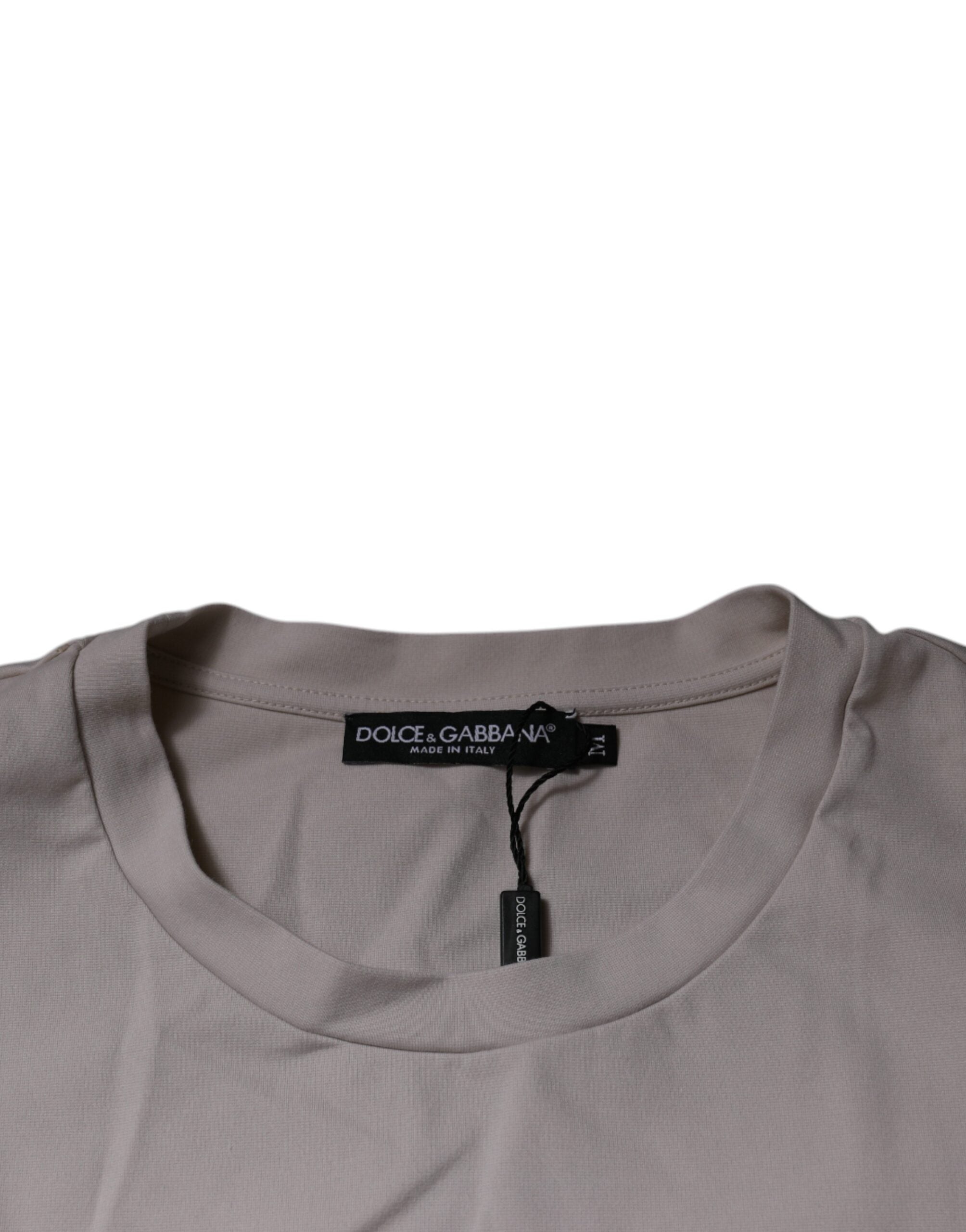 T-shirt beige Dolce & Gabbana avec logo DG, col rond, manches courtes, vue de face.
