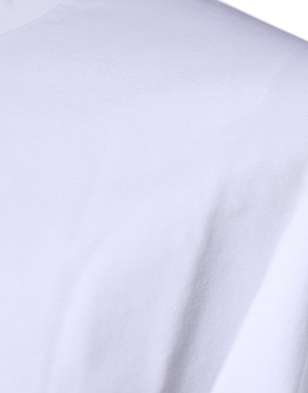 T-shirt blanc en coton Dolce & Gabbana avec logo DG, col rond et coupe classique, visible sur l'image.