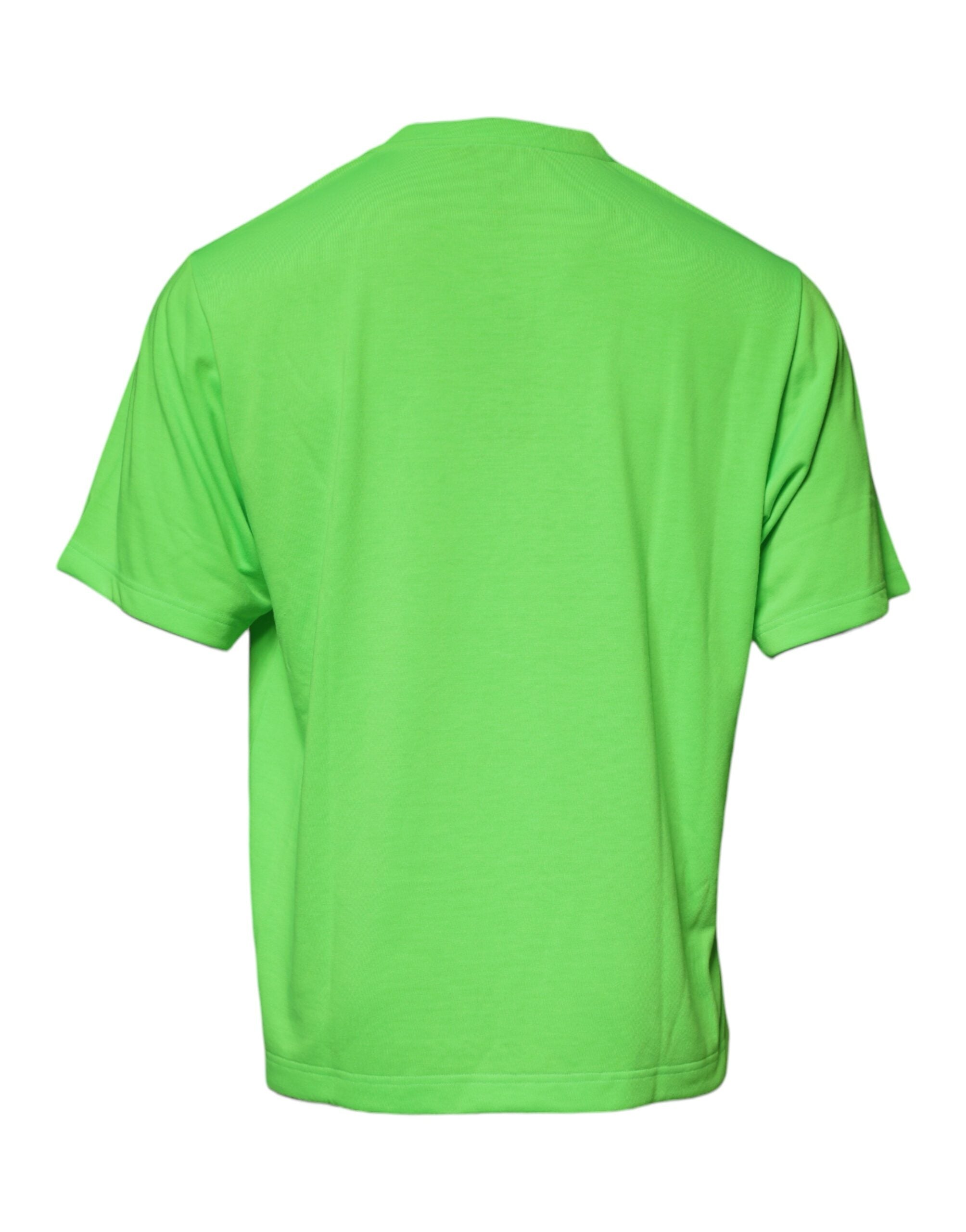 T-shirt en coton vert Dolce & Gabbana avec logo DG, col rond et design moderne, visible sur l'image.
