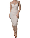 Robe bustier midi en tulle blanc Dolce & Gabbana, silhouette moulante, look élégant et sophistiqué, détail transparent.