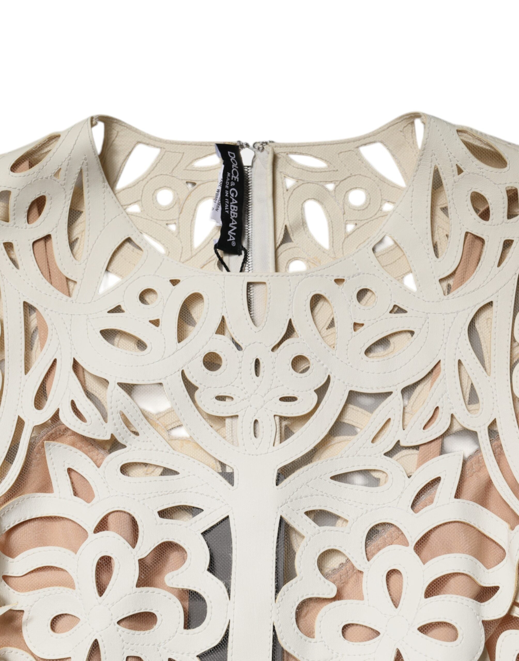 Robe midi sans manches en cuir blanc avec découpes, de la marque Dolce & Gabbana, élégante et moderne.