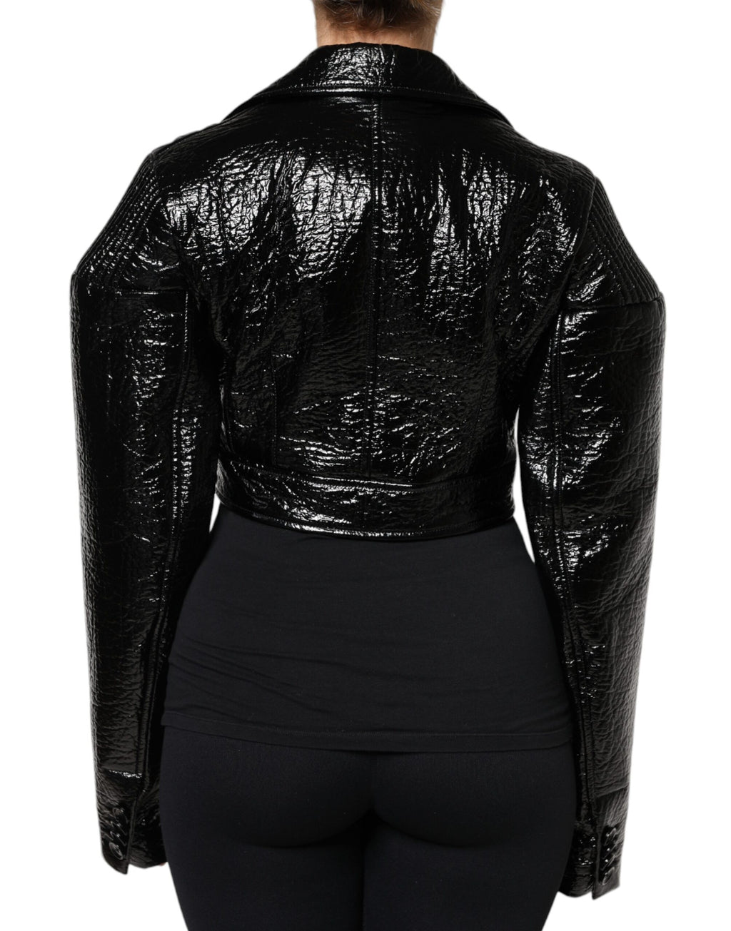 Manteau court noir en cuir de Dolce & Gabbana avec manches longues et coupe cropped, élégant et stylé.