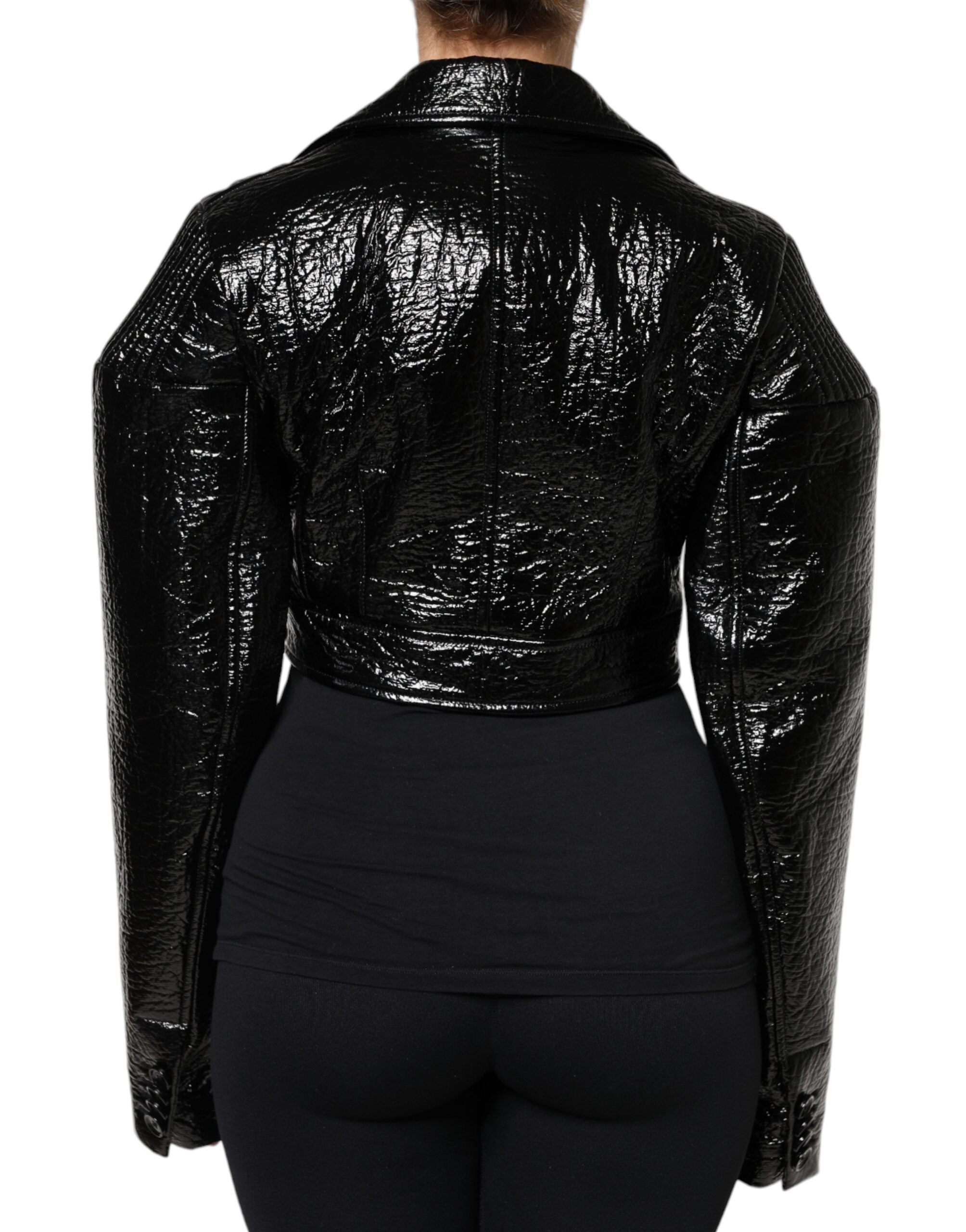 Manteau court noir en cuir de Dolce & Gabbana avec manches longues et coupe cropped, élégant et stylé.