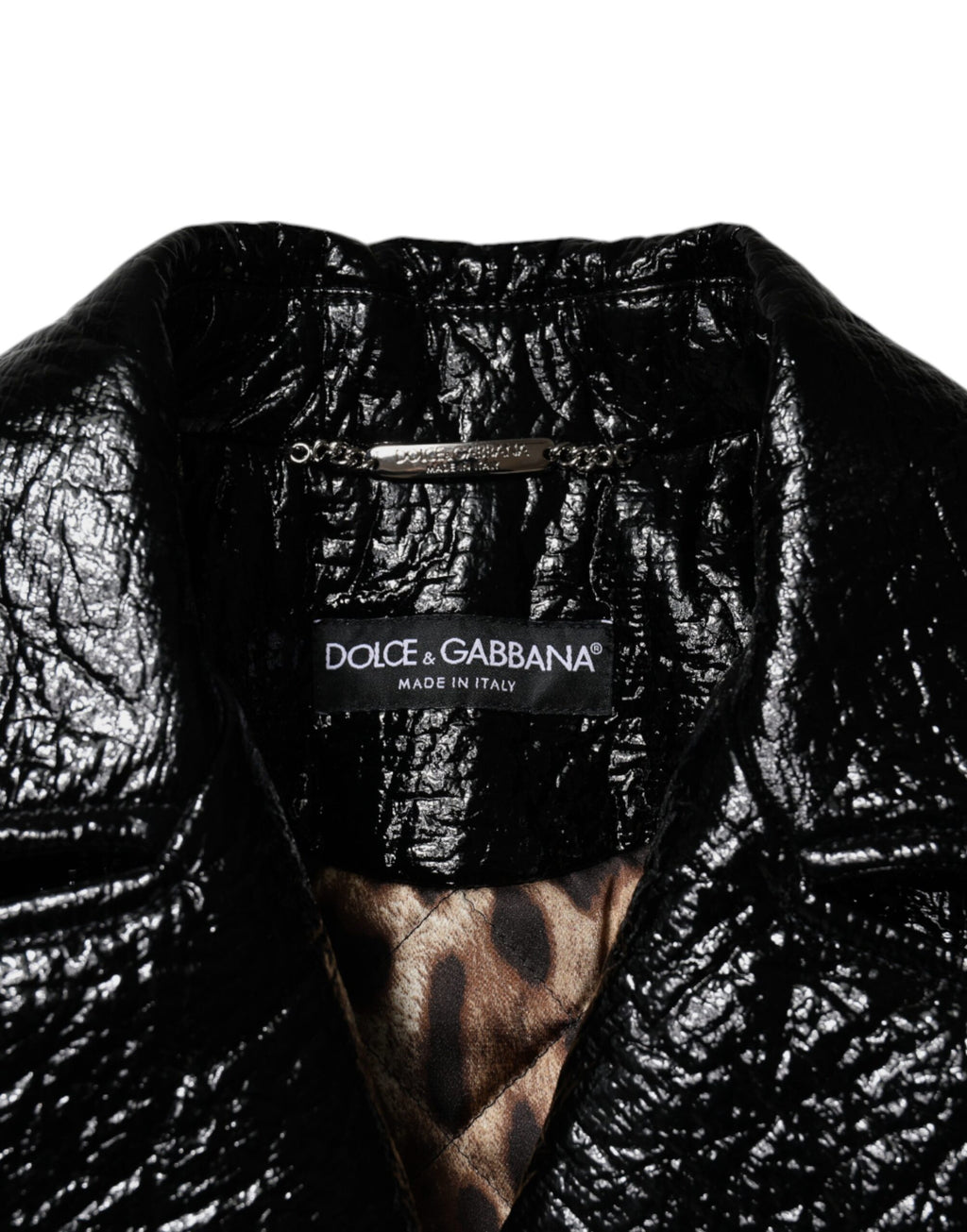Veste courte en cuir noir Dolce & Gabbana avec manches longues et coupe crop, élégante et sophistiquée.
