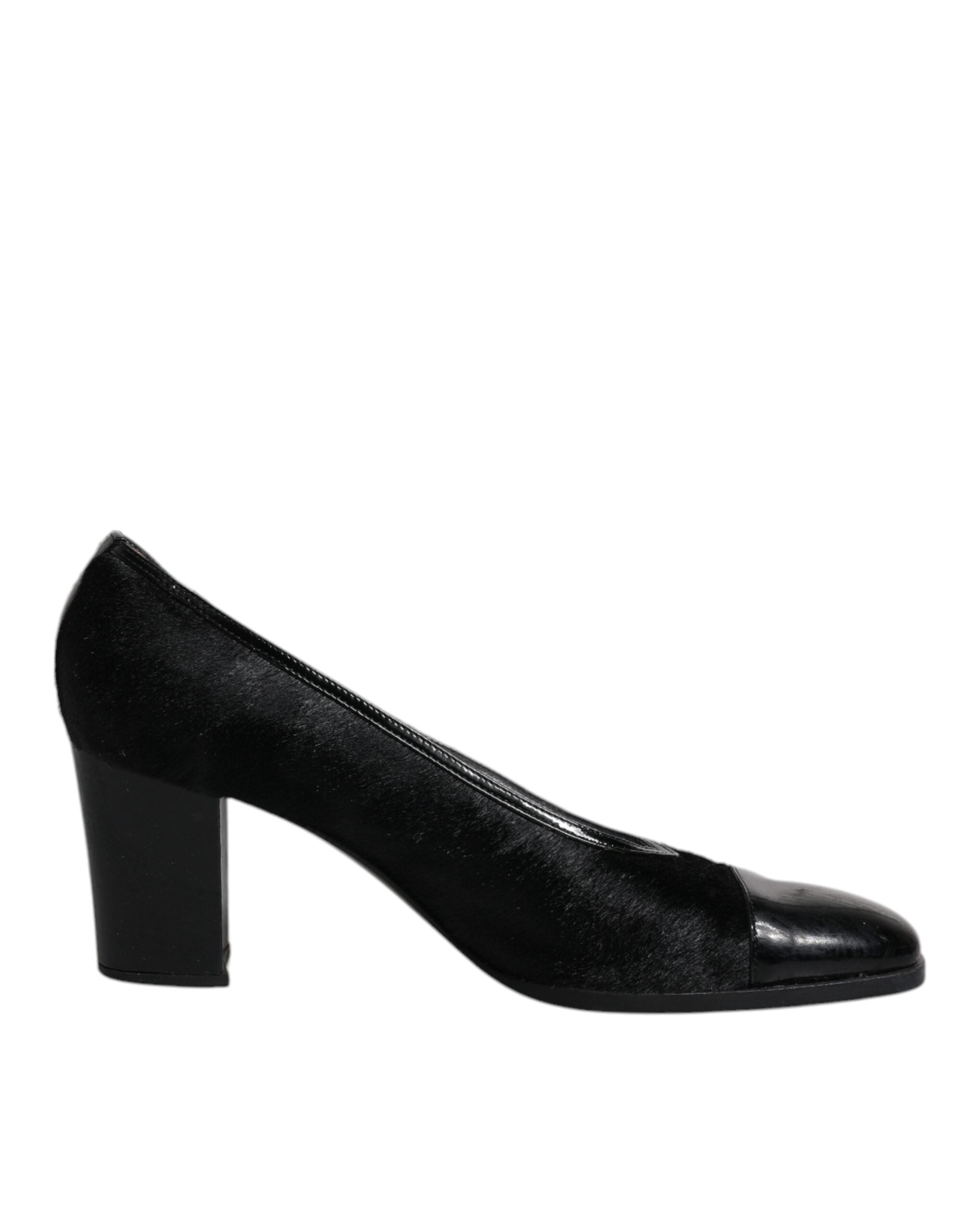 Chaussures à talons blocs en cuir noir de Dolce & Gabbana, élégantes escarpins avec semelle en cuir et design sophistiqué.