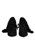 Chaussures à talons stilettos noirs Dolce & Gabbana, bottes mi-mollet élégantes en cuir avec finition soignée.