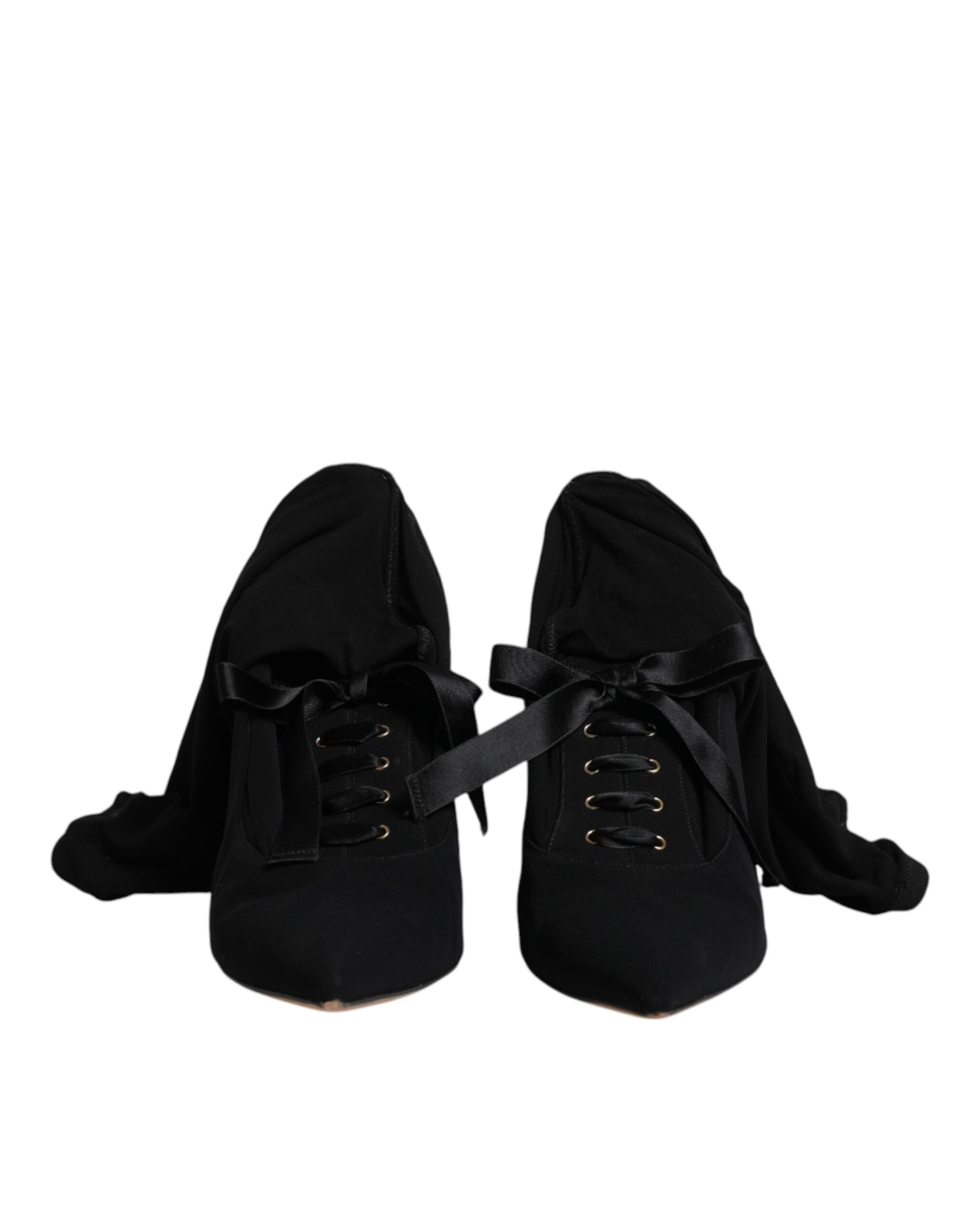 Chaussures à talons stilettos noirs Dolce & Gabbana, bottes mi-mollet élégantes en cuir avec finition soignée.