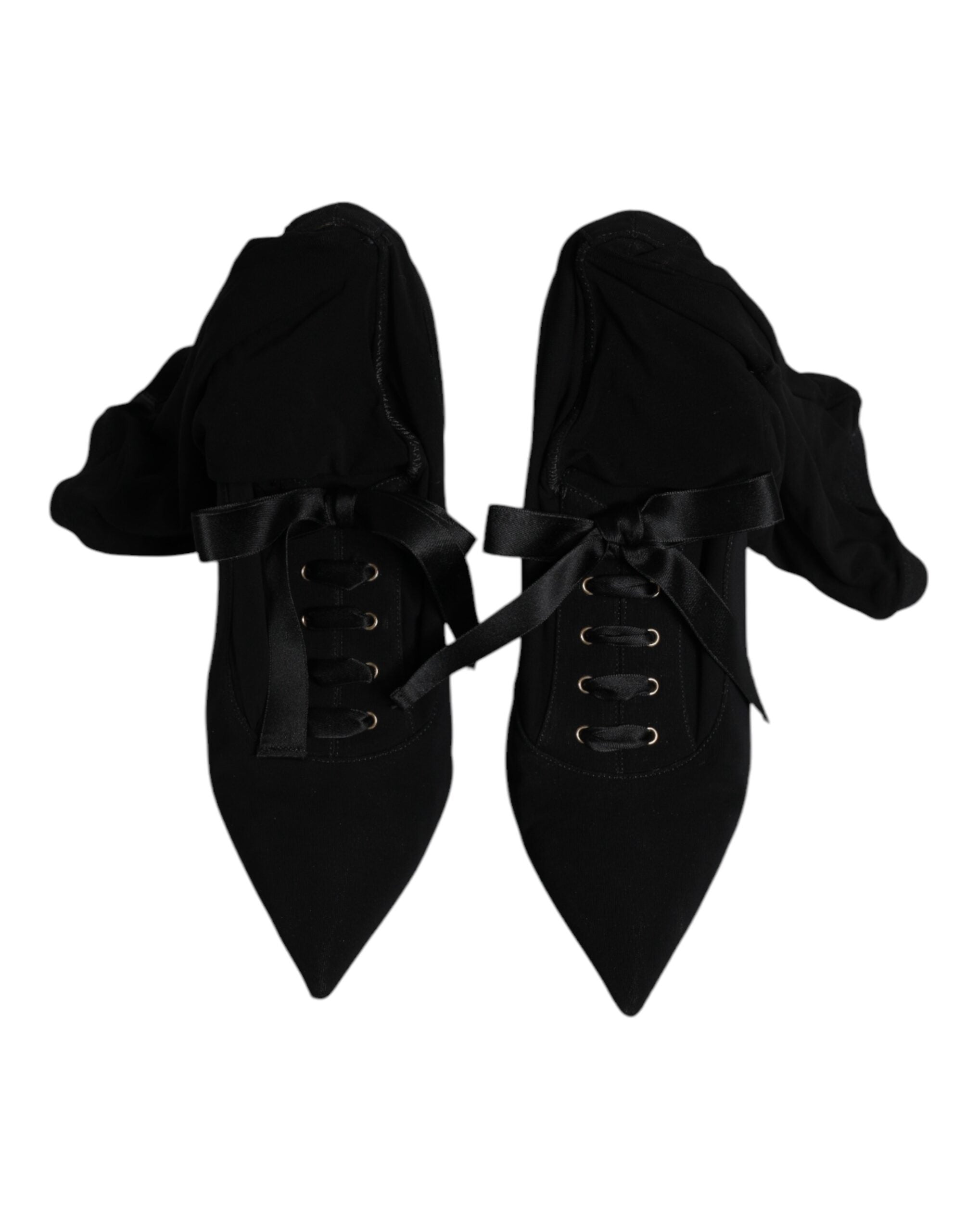Chaussures Dolce & Gabbana stilettos noirs à talons hauts et bottines mi-mollet en cuir, élégantes et sophistiquées.