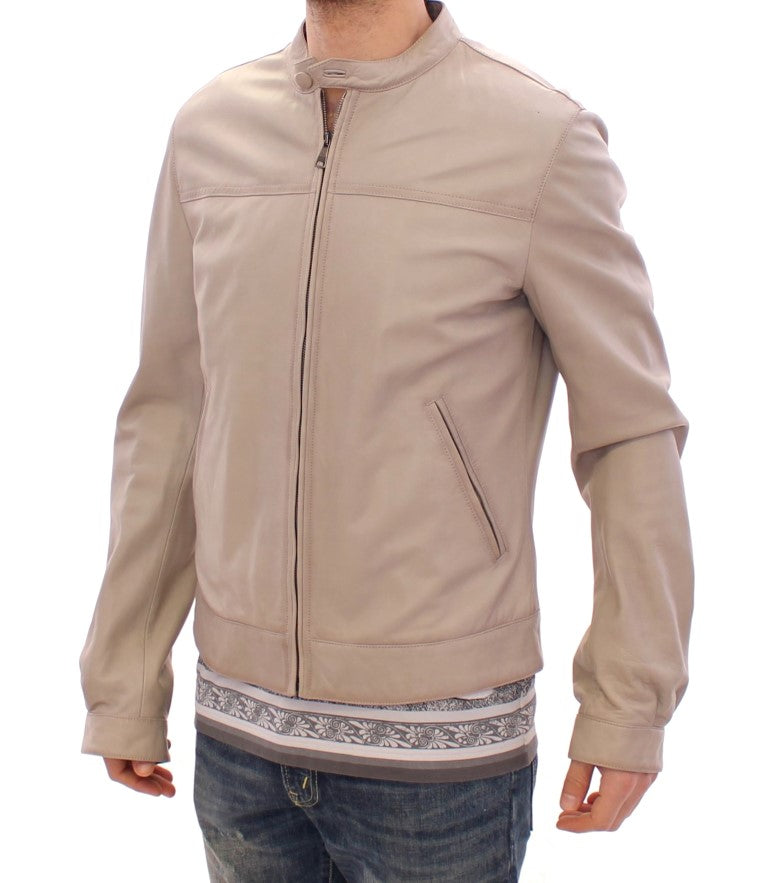 Veste en cuir beige de style motard Dolce & Gabbana, coupe ajustée avec détails en relief et fermeture éclair.