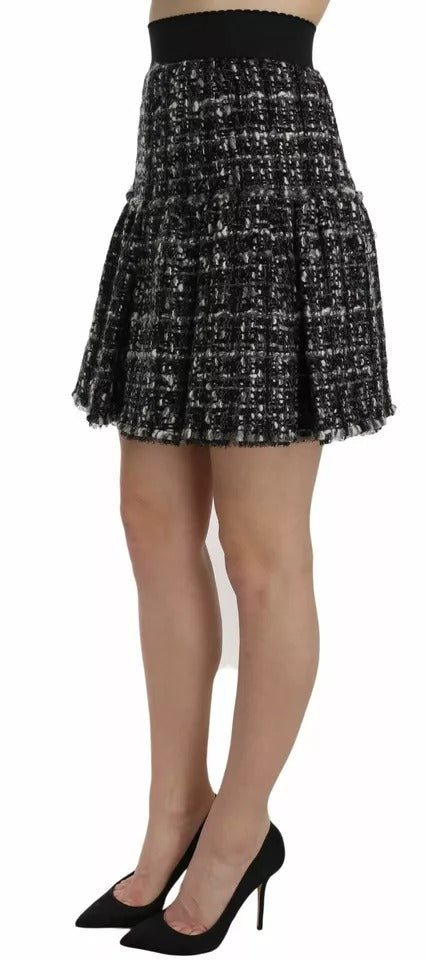 Jupe courte en laine noire à carreaux avec volants et détails sophistiqués, de la marque Dolce & Gabbana.