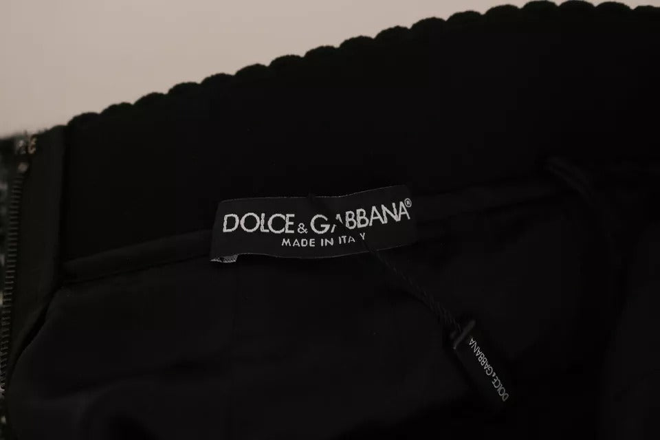 Jupe courte en laine à carreaux noirs avec détails volantés de Dolce & Gabbana, style élégant et tendance.
