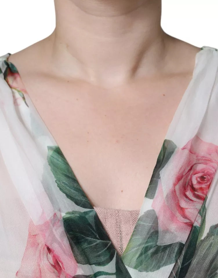 Robe midi en soie blanche à imprimé floral de Dolce & Gabbana, coupe évasée et élégante.