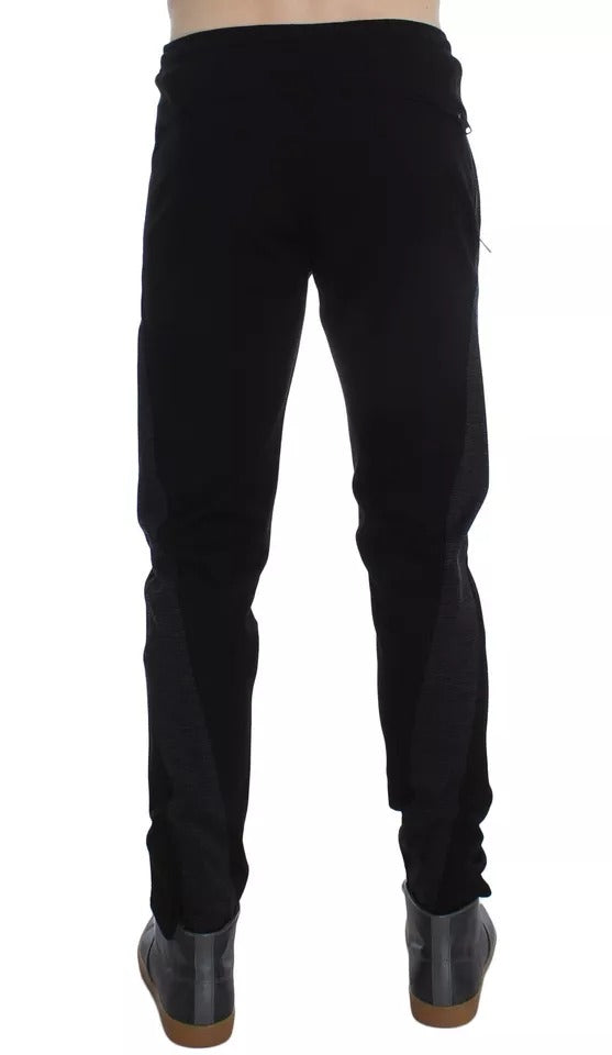 Pantalons décontractés en laine noire et grise avec rayures de la marque Dolce & Gabbana, vue de face.