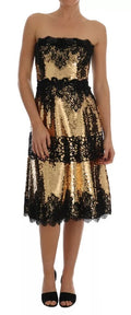 Robe bustier Dolce & Gabbana en dentelle avec sequins dorés et embellissements, sans bretelles, élégante et brillante.