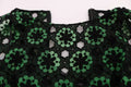 Robe trapèze verte Dolce & Gabbana avec broderie florale et design élégant, idéale pour une tenue chic et raffinée.