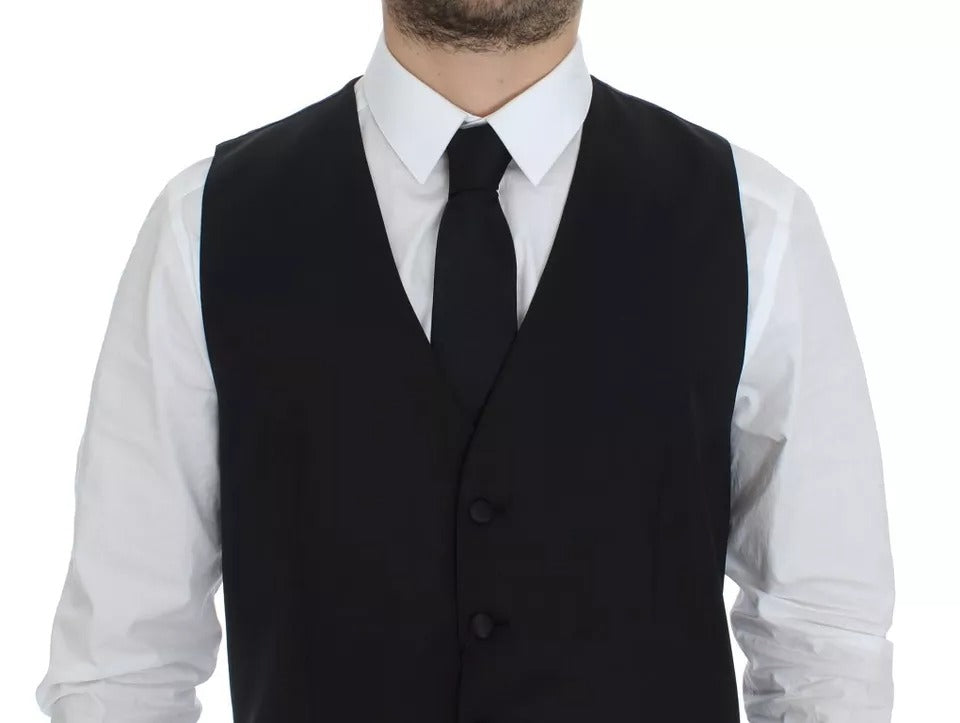 Gilet noir en laine et soie de Dolce & Gabbana, veste élégante avec coupe ajustée, porté sur un fond neutre.