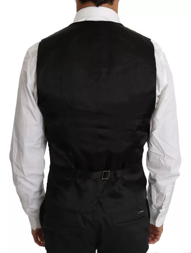 Gilet en laine noire Dolce & Gabbana avec logo, ajusté à la taille, détails élégants et finition soignée.