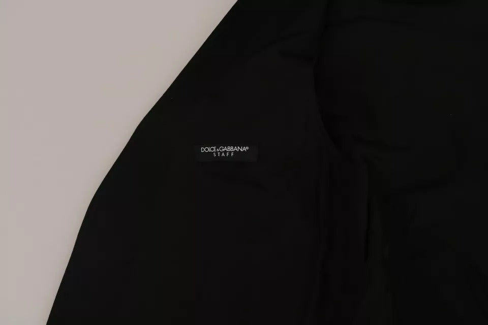 Gilet en laine noire Dolce & Gabbana avec logo, image montrant la texture douce et le design élégant du vêtement.