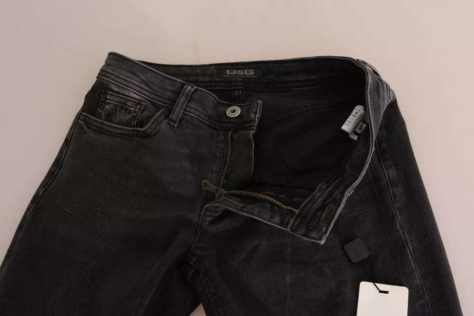 Jeans slim noir en coton de Dolce & Gabbana, pantalon D&G avec coupe ajustée et détails modernes visibles sur l'image.
